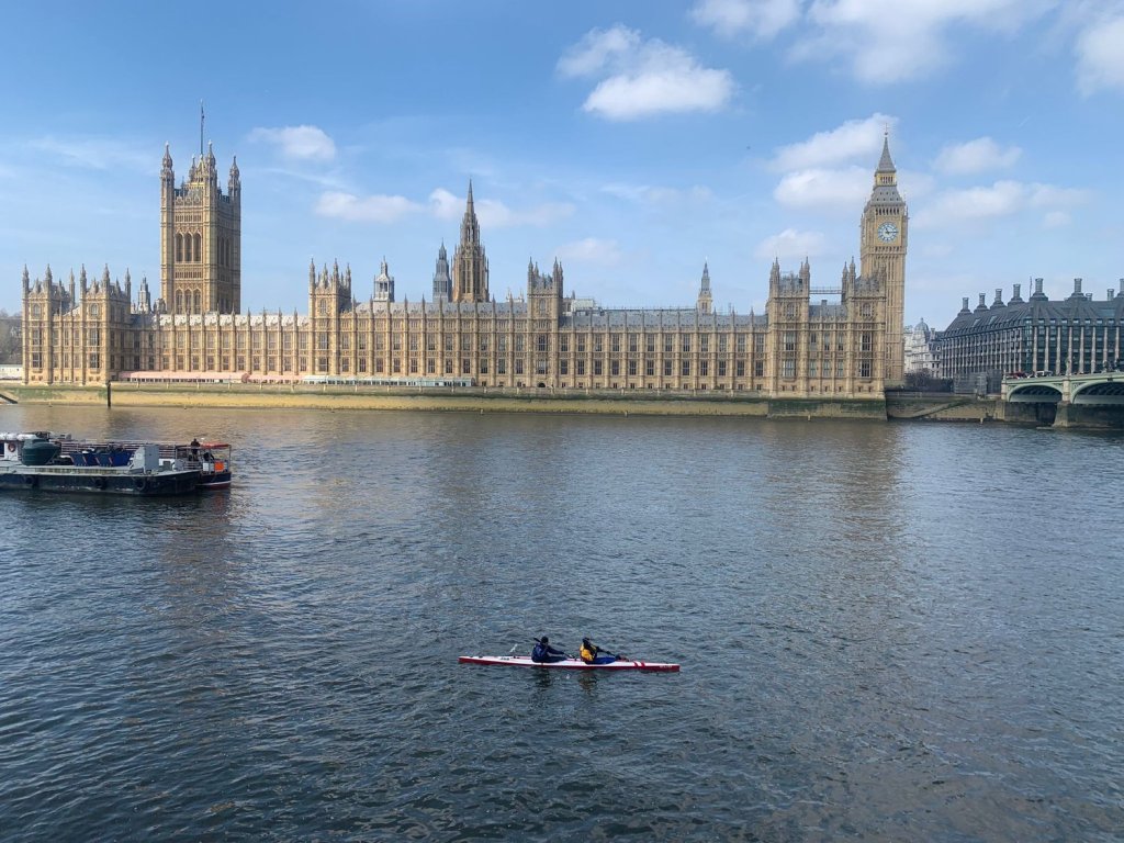 A K2 finishes DW at Westminster, looking small on the Thames with Parliament in the background